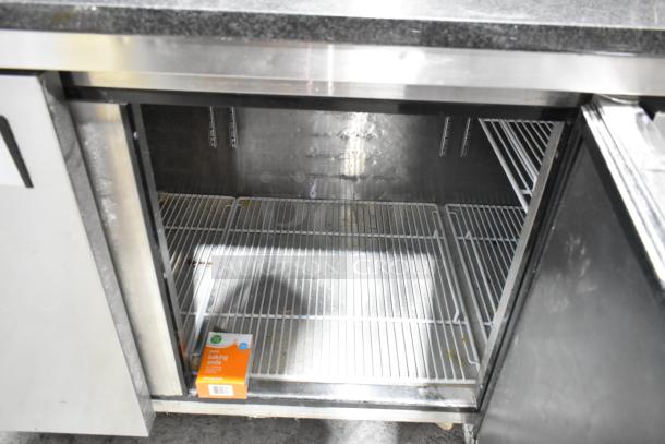 2019 Atosa P-93-GR pizza prep table, stainless steel, black stone cutting board, commercial casters, interior view.