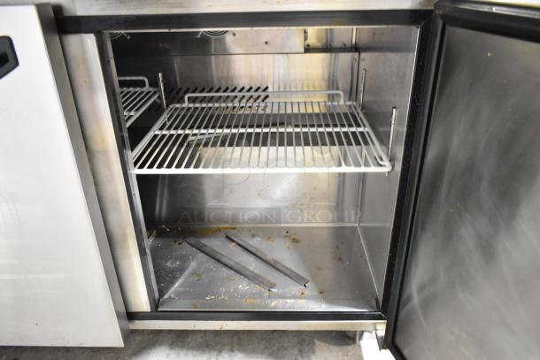 2020 Padela PDS-48-HC stainless steel prep table, interior shelves, visible wear. Commercial casters. 115V, 1 phase.