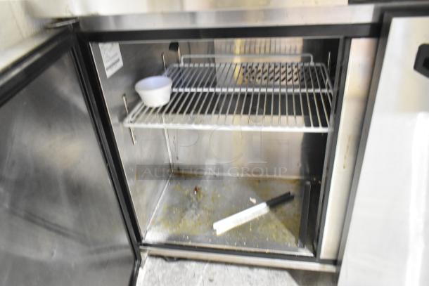 2020 Padela PDS-48-HC stainless steel sandwich prep table interior. Includes shelf and white bowl; some wear visible.