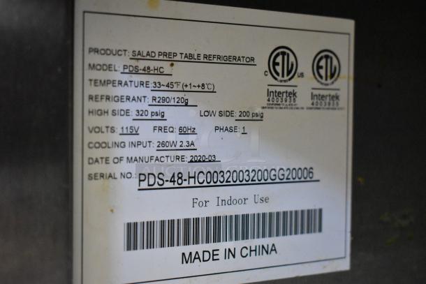 Label on Padela PDS-48-HC stainless steel sandwich prep table, detailing model, voltage, refrigerant, and manufacture date.