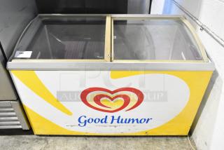 Caravell 406-995 metal chest freezer merchandiser, 115V, with Good Humor branding, sliding glass doors, minor wear.