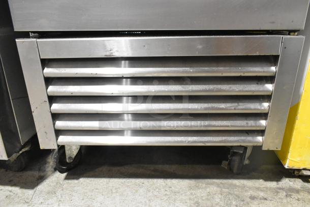 2018 True T-23-HC stainless steel reach-in cooler with poly-coated racks, on commercial casters. 115 Volts, 1 Phase.