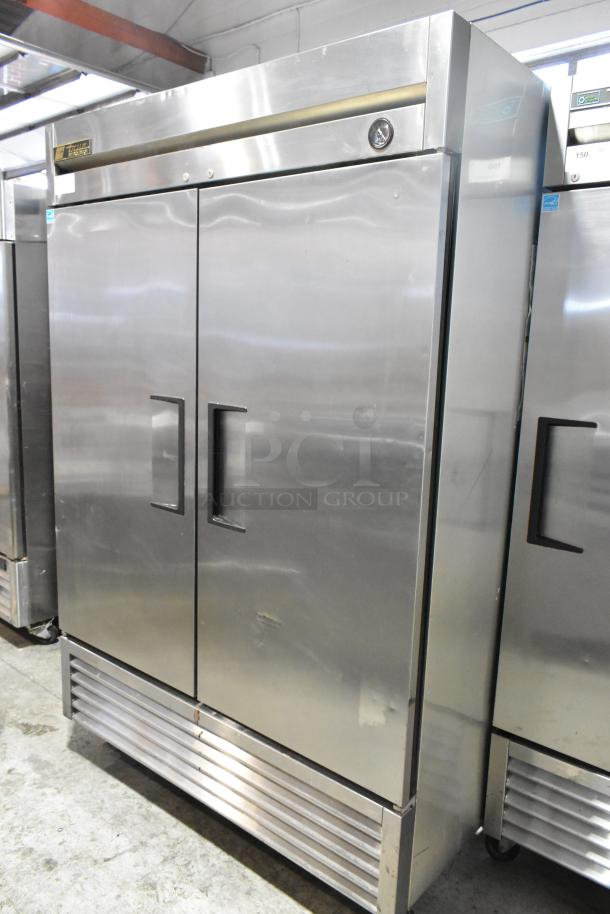 2016 True T-49 stainless steel 2-door commercial cooler, poly coated racks, on casters, 115V, 1 phase, good condition.