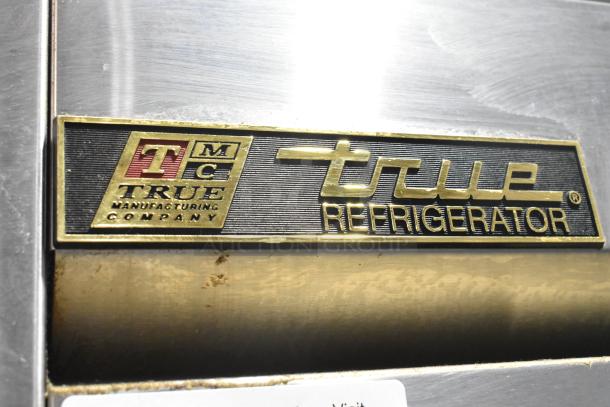 2016 True T-49 stainless steel commercial cooler, 2-door, poly-coated racks, commercial casters, 115V, 1 phase.