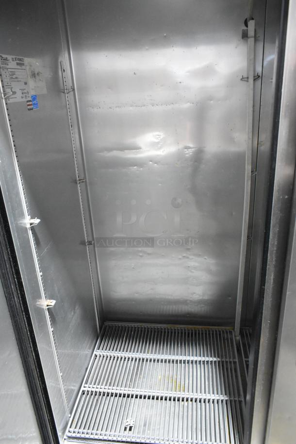 2016 True T-49 stainless steel commercial cooler, interior view. Features poly-coated racks, on commercial casters. Model T-49.