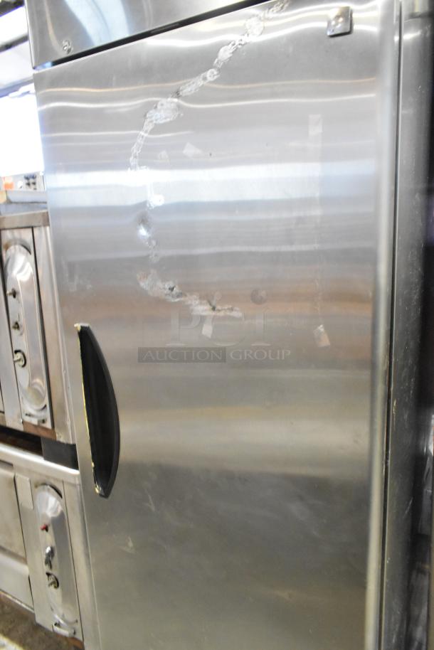 2020 Padela PDB-1F-HC stainless steel commercial freezer with single door, visible dents, poly-coated racks, on casters.