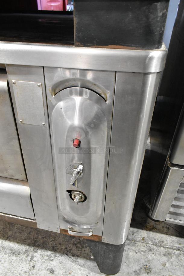 Blodgett 1000-S stainless steel commercial pizza oven, natural gas, 60,000 BTU, visible wear, includes pizza stones.