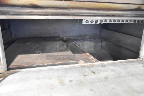 Blodgett 1000-S stainless steel commercial pizza oven with pizza stones. Natural gas powered, 60,000 BTU, single deck.