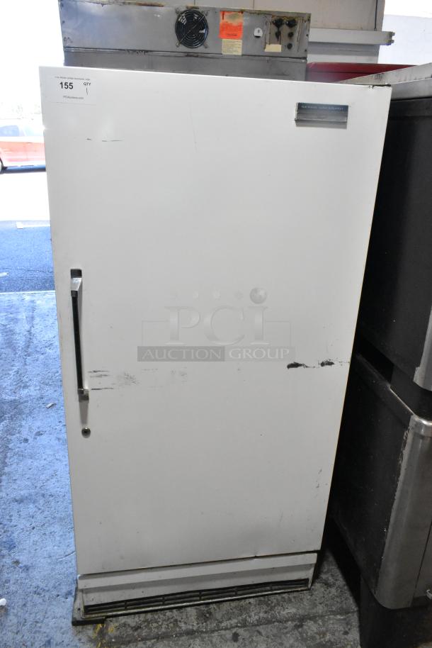 Sears Coldspot 106 metal single door reach-in freezer, visible wear, 115 volts, 1 phase, model tag on top right.
