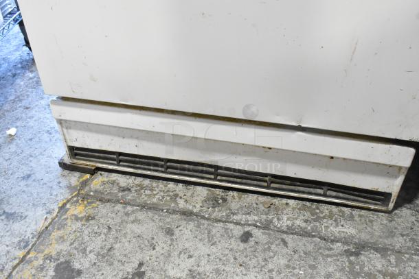 Sears Coldspot 106 Reach-In Freezer, metal, single door, 115 volts, 1 phase. Visible wear and minor scuffs on surface.