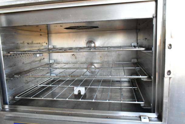 Nu Vu SUB-123 commercial electric oven proofer, stainless steel, 208 volts, 3 phase, visible signs of use, on commercial casters.