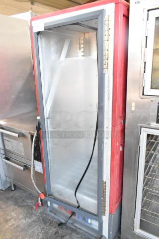 Metro C5 Metal Commercial Heated Holding Cabinet with casters, red and silver, used condition, open door showing interior shelves.