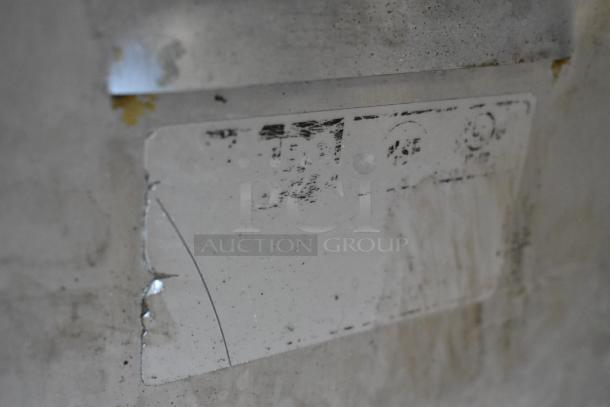 Metro C5 commercial heated holding cabinet on casters, metal, visible wear and scratches, partially visible label.