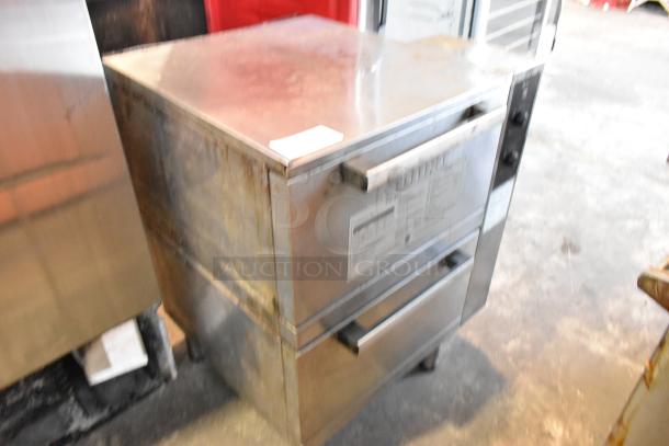 Rinnai stainless steel commercial gas-powered 2-drawer food warmer. Features visible control knobs and label. Good condition.
