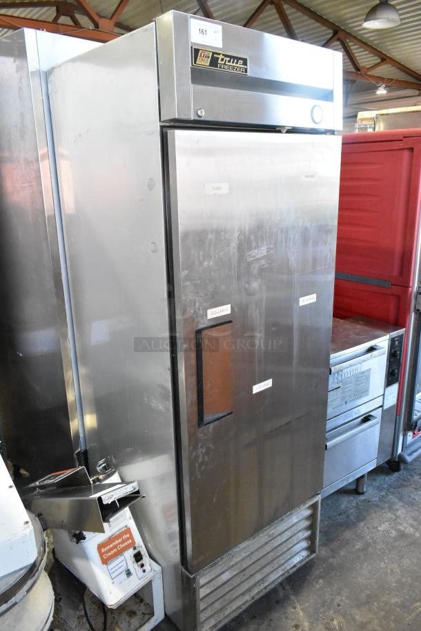 True T-23F stainless steel commercial freezer with single door, poly-coated racks, 115 volts, 1 phase, visible labels.