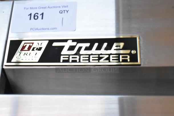 True T-23F Stainless Steel Commercial Single Door Freezer with label showing model and auction details. 115 Volts, 1 Phase.