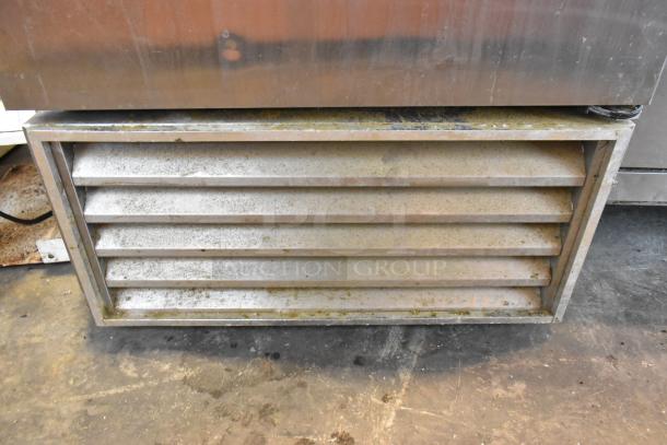 True T-23F stainless steel commercial single door freezer vent detail, showing poly coated racks; 115V, 1 Phase.