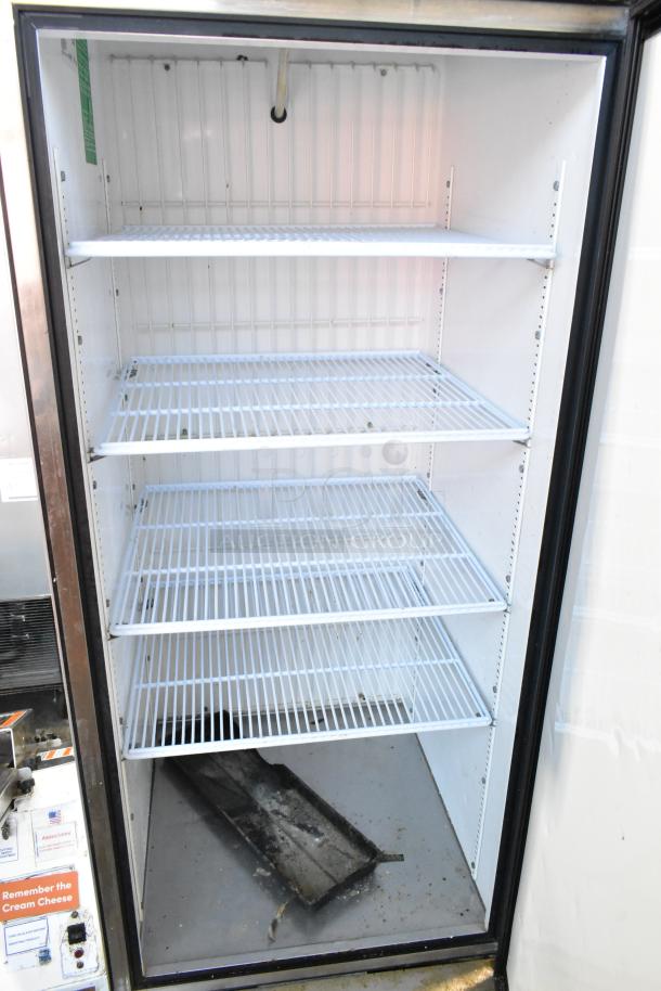 True T-23F stainless steel commercial freezer, single door, with poly coated racks, 115V, in used condition.