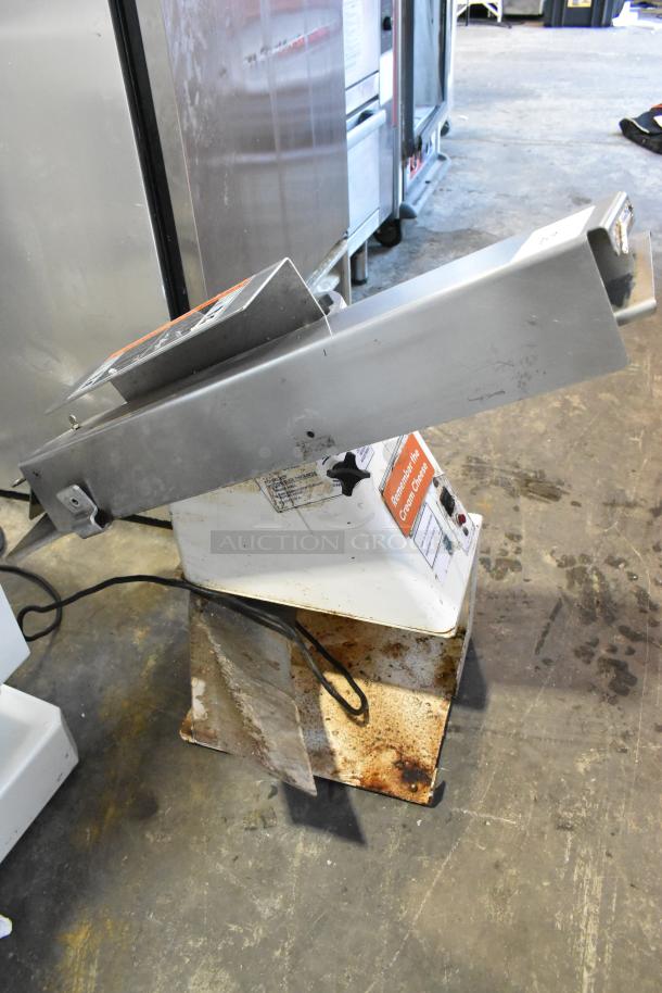 Oliver 702-N metal commercial countertop bagel slicer, 115 volts, 1 phase, some visible wear and usage marks.