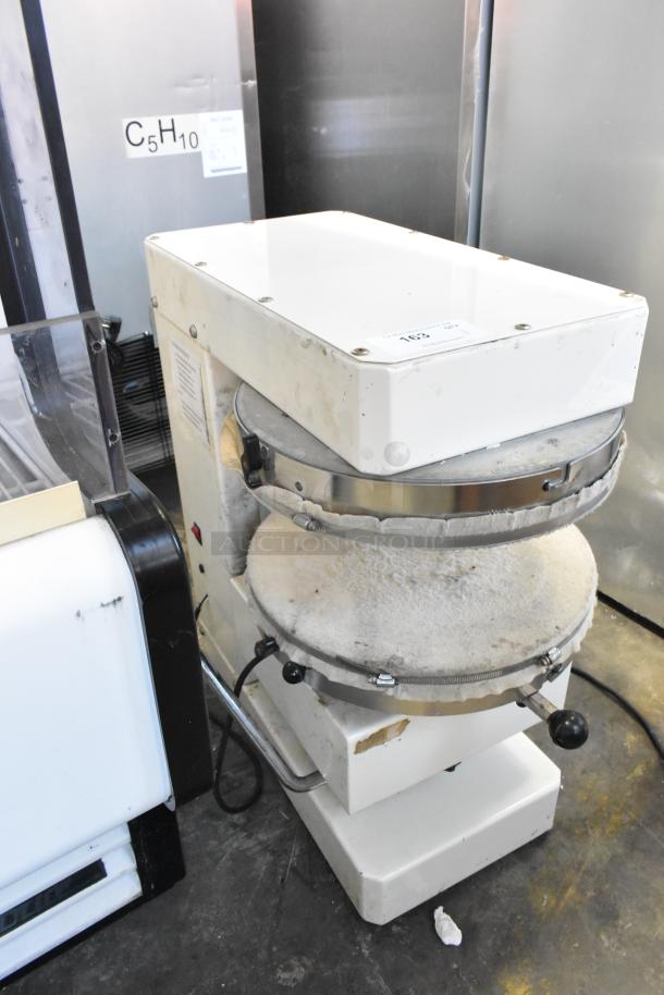 HD&Tek Sprizza metal commercial countertop pizza dough press, used condition, 220 volts, 1 phase, visible wear marks.