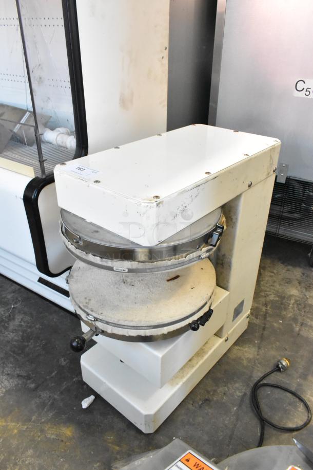 HD&Tek Sprizza metal commercial countertop pizza dough press, 220V, 1 phase, in used condition with visible wear marks.