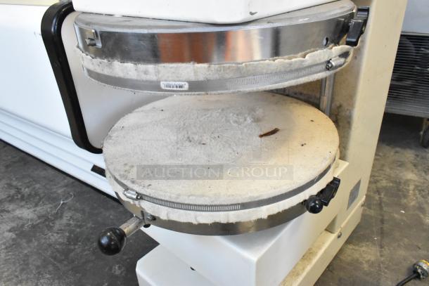 HD&Tek Sprizza metal countertop pizza dough press. 220V, 1 phase. Moderate wear, visible control knobs, textured pressing surface.