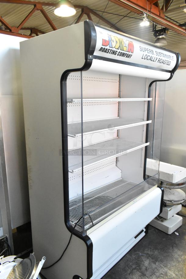 True TAC-48GS-LD metal commercial grab-n-go merchandiser, 208-230 volts, 1 phase. Features shelves, branded top panel.