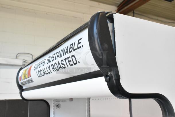 True TAC-48GS-LD commercial merchandiser, metal build, grab-and-go style. Features "Superb. Sustainable. Locally Roasted." text.