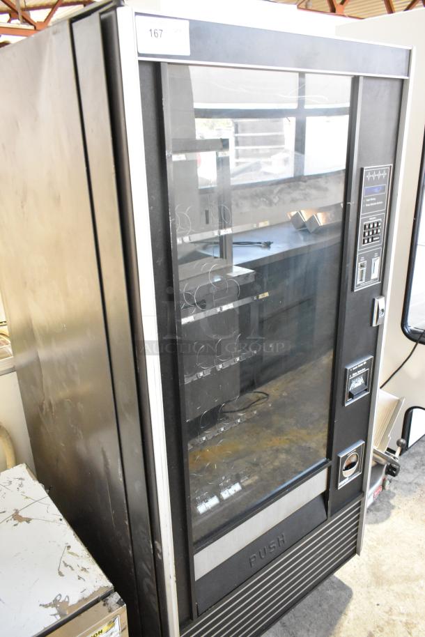 Genesis 5900 JR Metal Vending Machine, floor style, 115 volts, 1 phase, visible keypad, used condition.