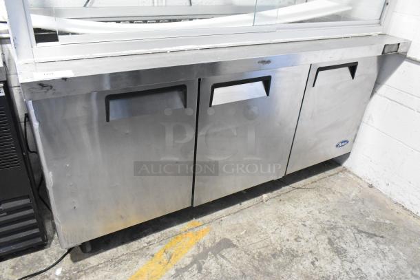 Atosa MSF8008 stainless steel commercial prep table with sneeze guard, on casters. Features three doors, 115V, 1 phase.