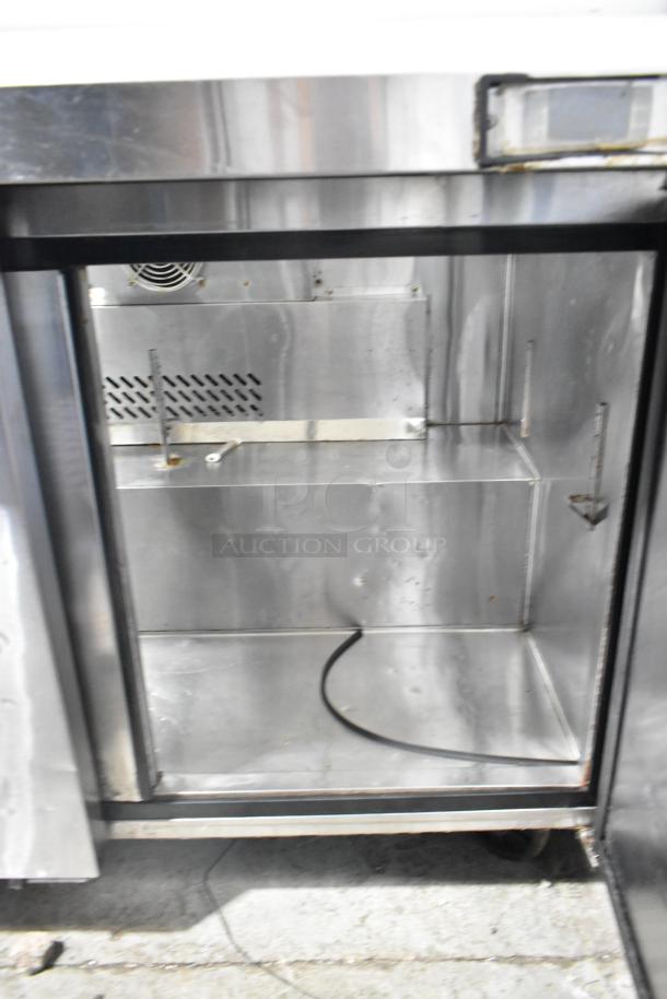Atosa MSF8008 stainless steel prep table, commercial design, on casters, features sneeze guard, 115V, 1 phase, interior view.