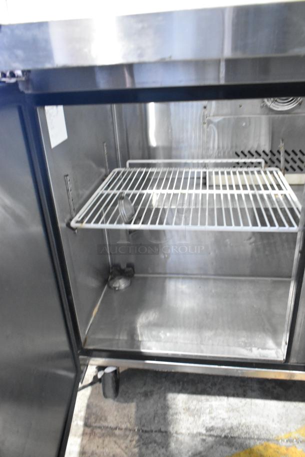 Atosa MSF8008 stainless steel commercial prep table, features a sneeze guard and commercial casters. Model: MSF8008.