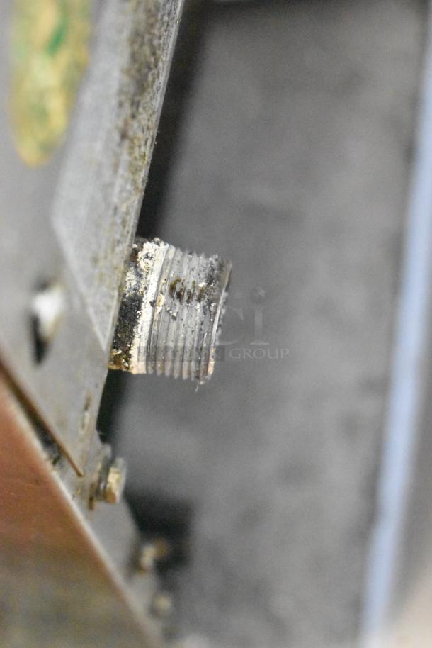 Jade Range JTRH-2FHT-36 gas connector detail, showing wear and residue, part of stainless steel commercial range unit.