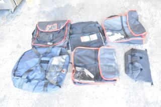 Seven hot food carrying bags, various sizes, black with red trim, good condition, some with clear window pockets.