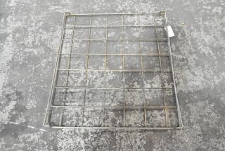 Metal rack with grid structure, sturdy, slightly worn condition, ideal for shelving or storage use.