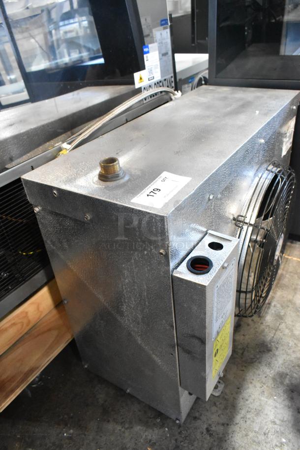 2018 Carrier CUR008ELBXE1SP metal commercial evaporator fan, metallic finish, visible operational labels, good condition.