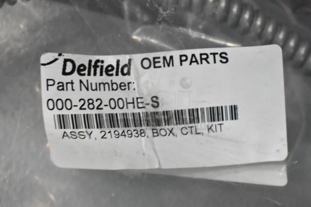 Delfield OEM part 000-282-00HE-S label showing part number, barcode, and kit details in brand new condition.