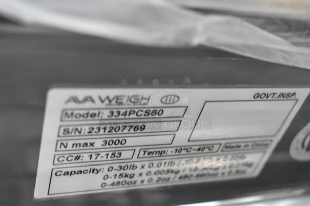 BRAND NEW SCRATCH AND DENT AvaWeigh 334PCS60 60 lb. digital price computing scale, model and capacity details visible.