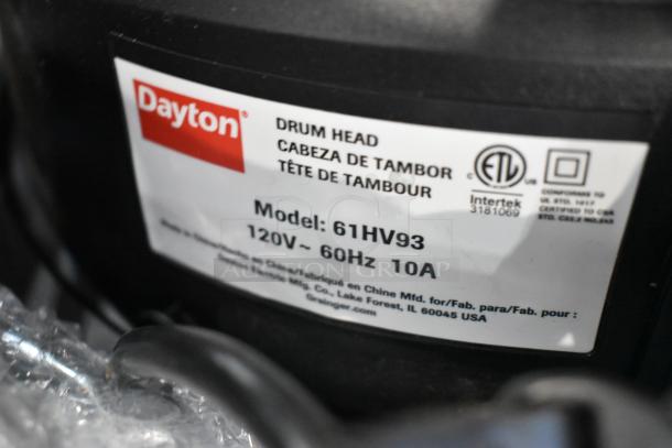 Dayton 61HV93 Drum Head label, 120V, 1 Phase, new with minor scratches, tags indicate model and voltage details.