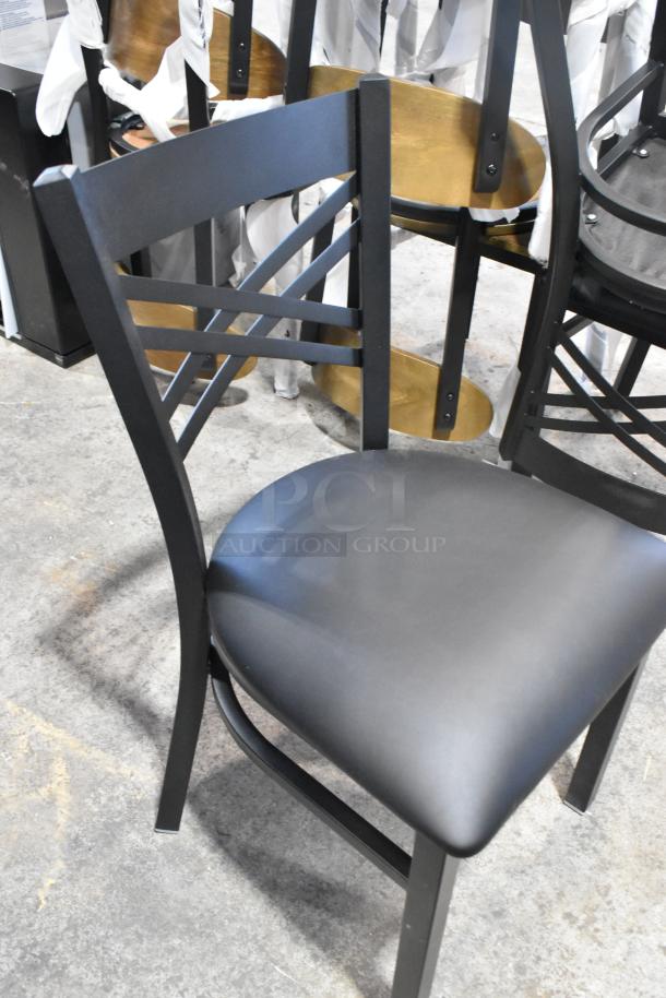 4 brand new Lancaster Table & Seating black metal cross-back dining chairs, black seat cushion, scratch and dent condition.