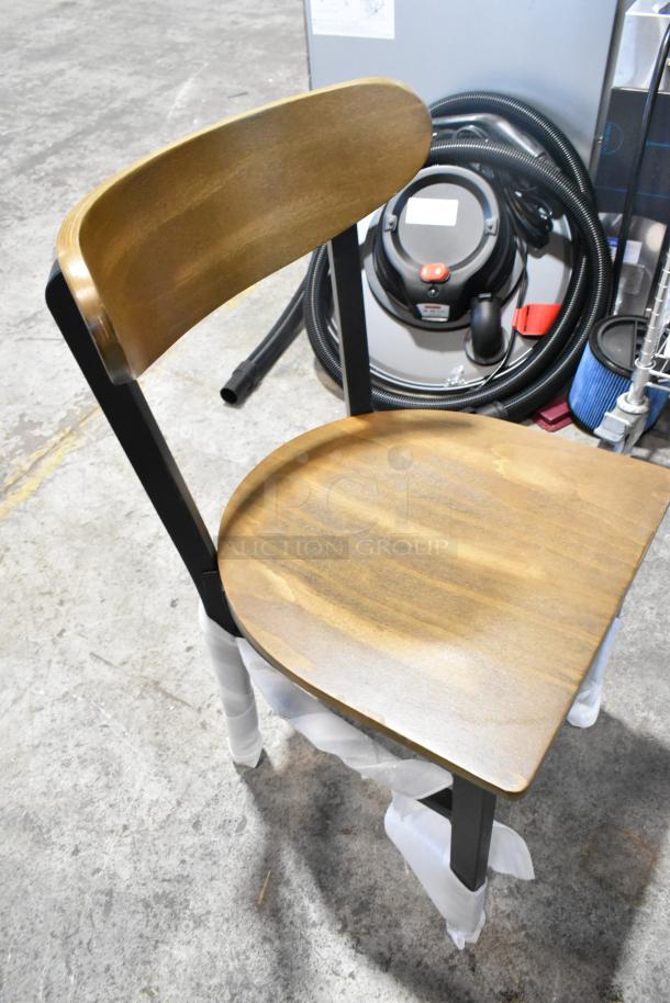 8 new Lancaster chairs with black metal frames, wooden backrests, and seats. Dining height. Scratch and dent condition.