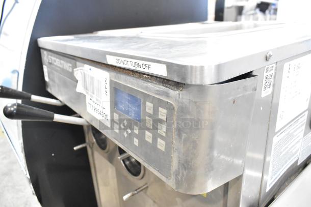 Stoelting SF121-38I2 stainless steel soft serve ice cream machine; features two flavors with twist, air-cooled, 208-240V, 1 phase.