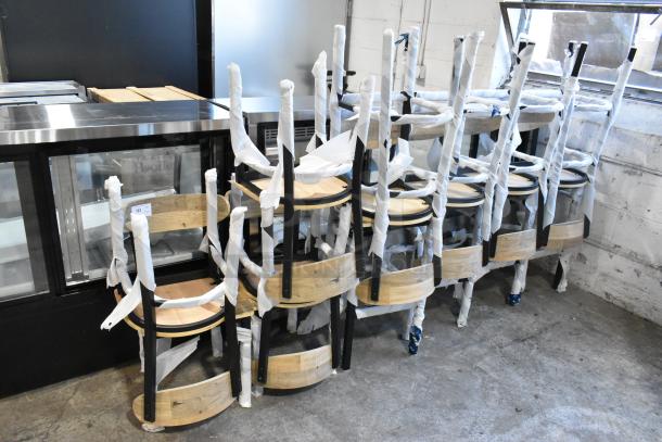 13 brand new Lancaster Table & Seating chairs, black metal with wooden backrests and seats, including 5 dining and 8 bar height, partially wrapped.