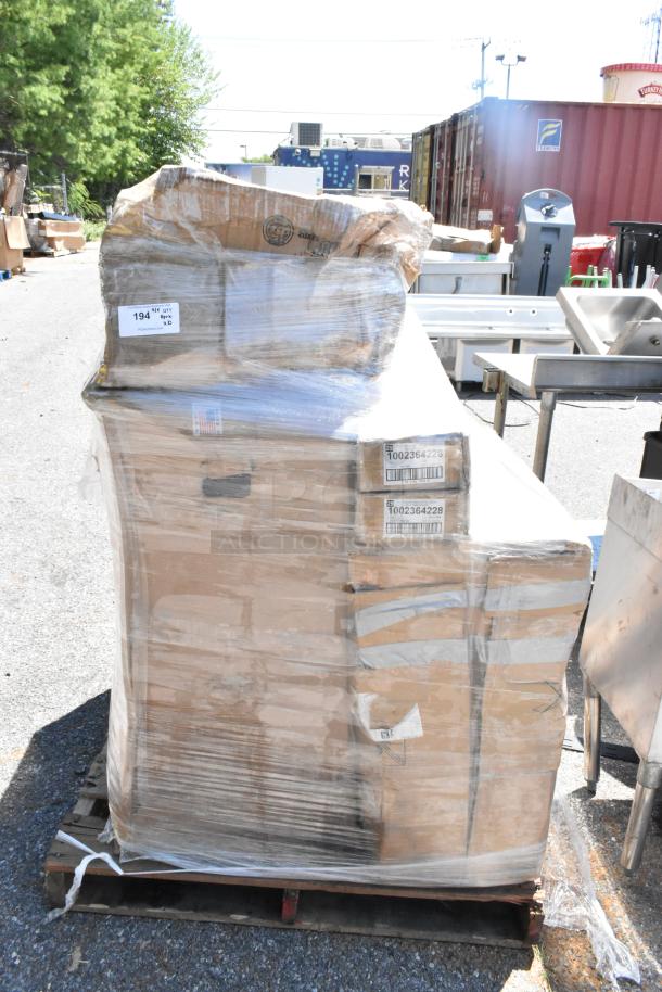 Stack of packaged boxes on a pallet, shrink-wrapped with visible labels. Items include customizable shopping bags, carpet extractor, and beverage dispenser, all in new condition.