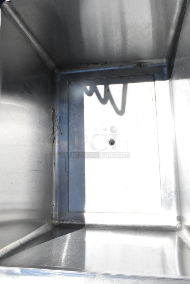 EUBIB-2418CP stainless steel ice bin with cold plate, model EUBIB-2418CP, showing interior in used condition.