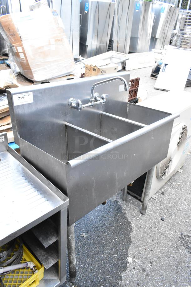 Stainless steel 3 bay sink with faucet and handles, pre-owned. Includes attached faucet and mounting handles.