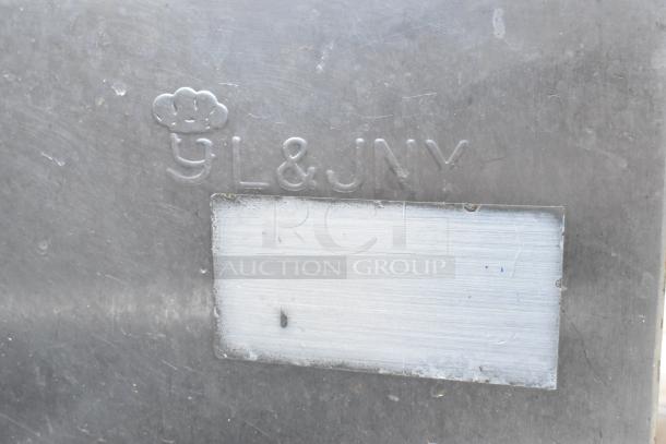 Stainless steel 3 bay sink with faucet and handles. Features "YL&JNY" marking. Good condition, ideal for commercial use.