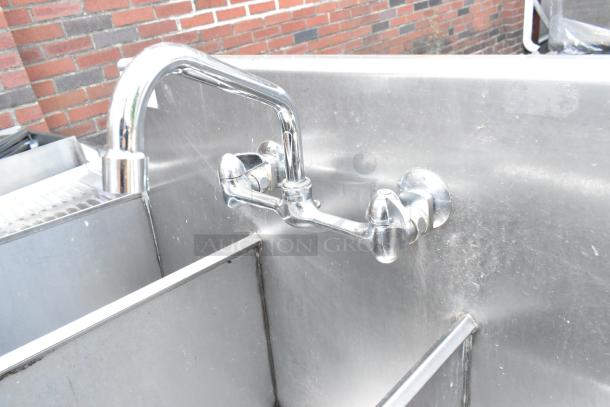 Stainless Steel 3 Bay Sink with faucet and handles, featuring a durable finish and wall mount design. Ideal for commercial use.