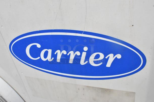 Carrier Xpower Air Conditioning Inverter, features blue logo. Minor surface wear visible. Ideal for efficient cooling.