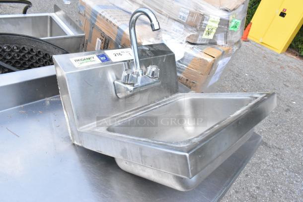 Regency stainless steel wall mount sink, single bay, includes faucet and handles, NSF approved, lightly used condition.